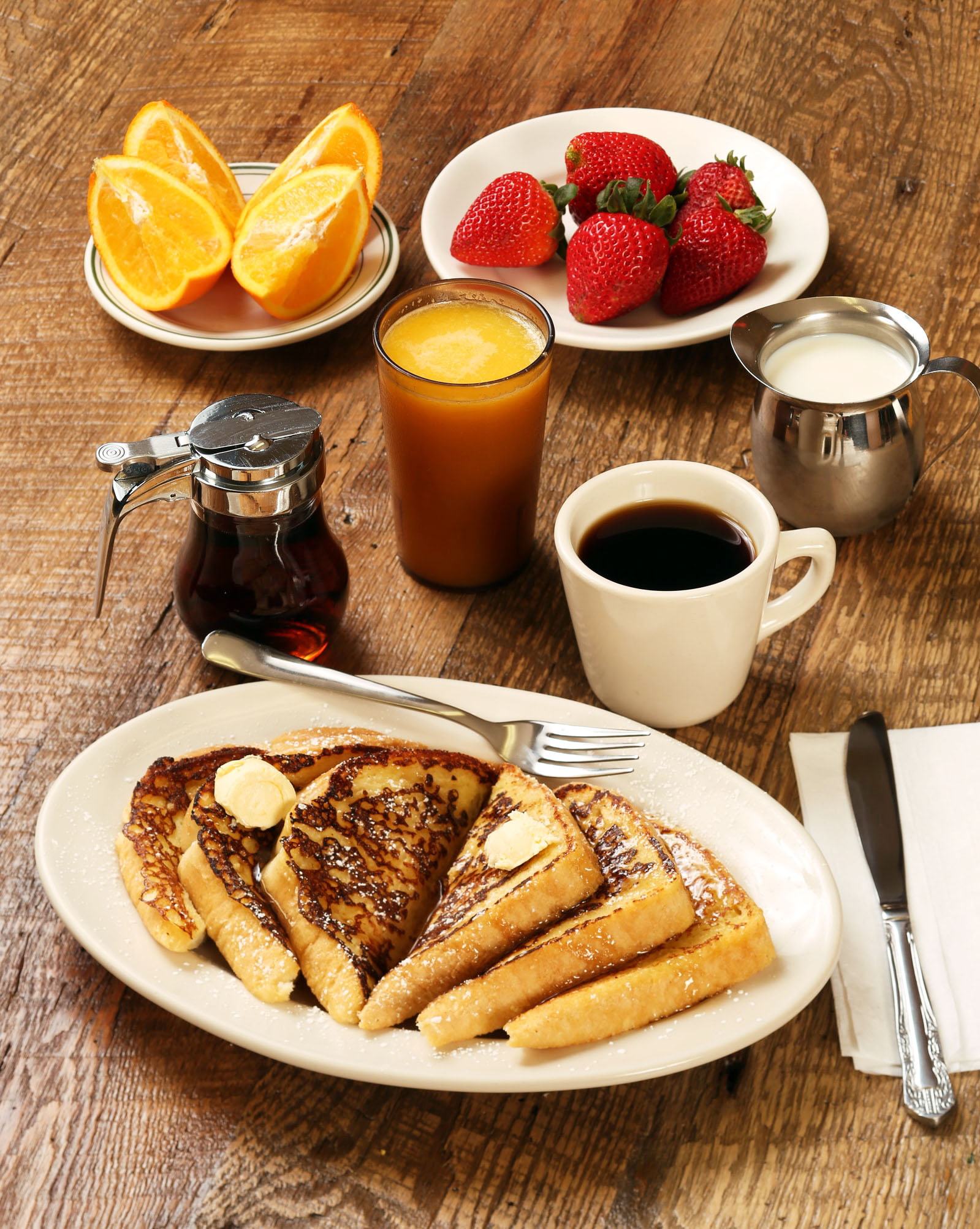 French toast breakfast with fresh berries, orange juice and coffee